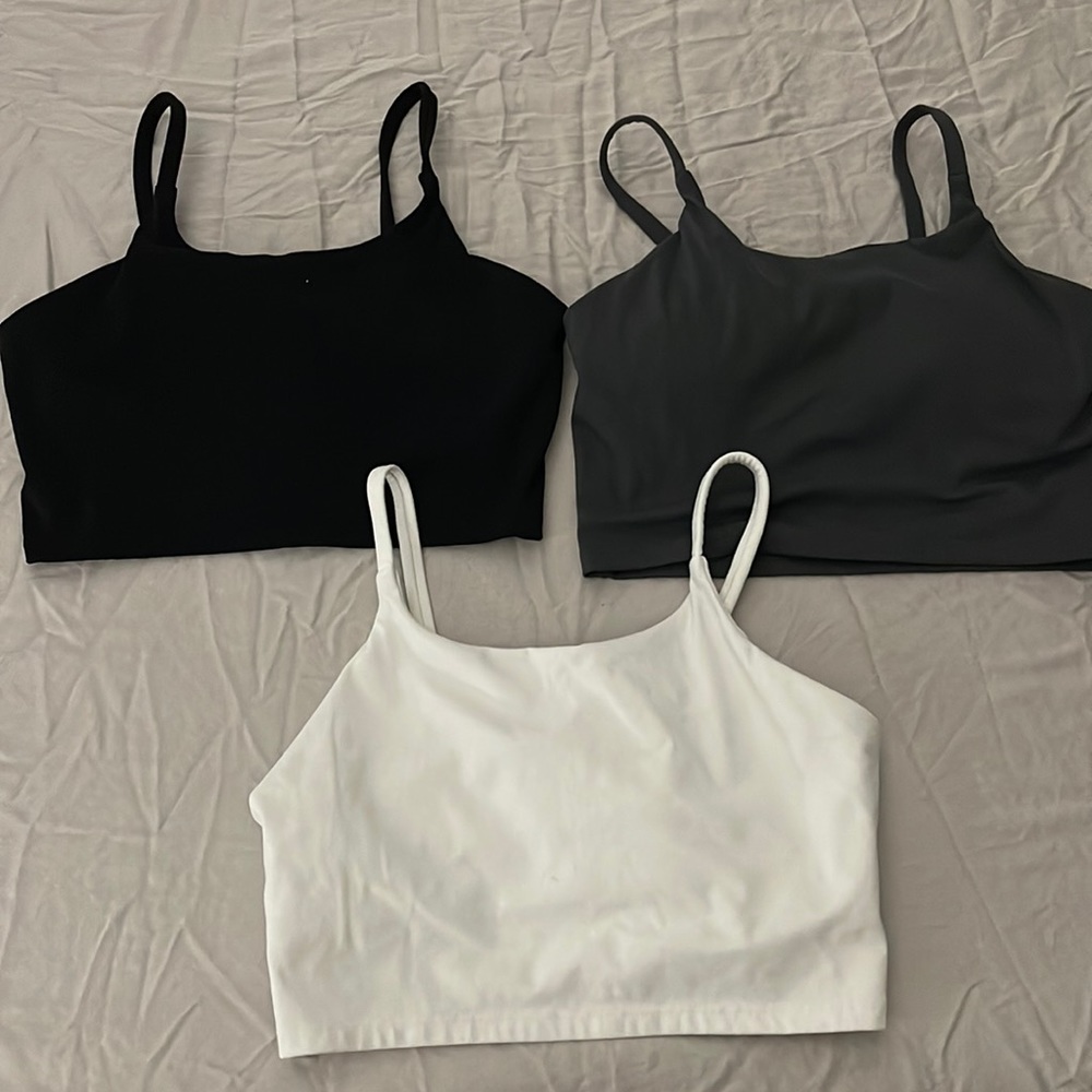 Three athletic tops built in shelf bra